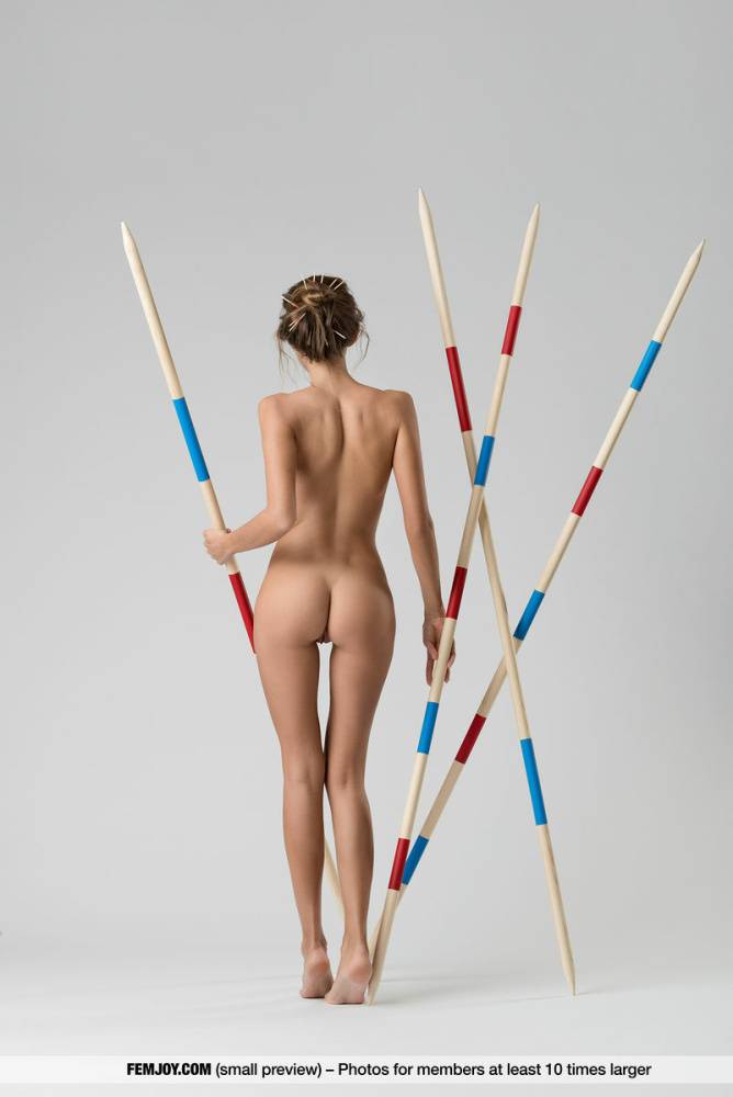 Caucasian solo girl Clover models totally naked amid javelins - #14
