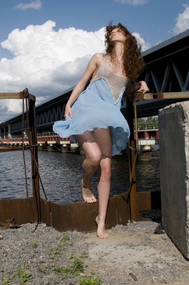 Solo girl with long wavy hair Talia A gets butt naked down by the water - #13