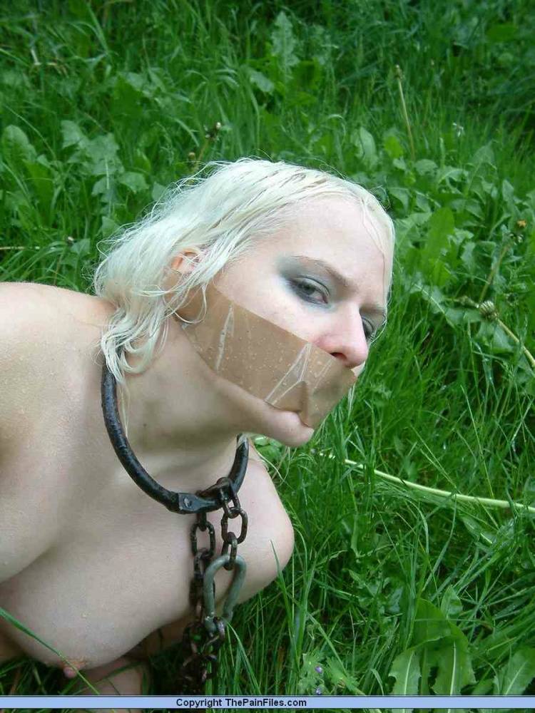 Naked blonde slave is caned and stomped on in a field of lush grass - #9