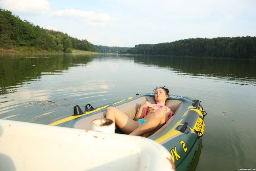 European teen with a flawless body relaxes in a small boat rubbing her snatch - #9