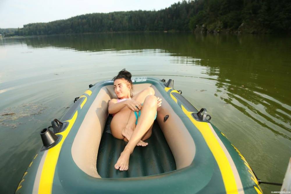 European teen with a flawless body relaxes in a small boat rubbing her snatch - #4