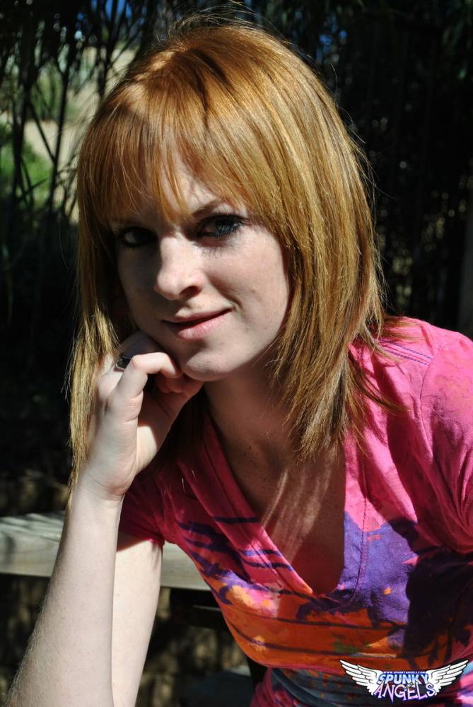Young redhead Kate Cooper hikes her skirt and flashes her twat against a fence - #6