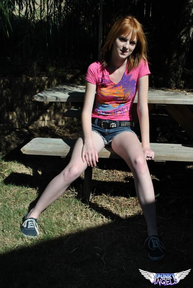 Young redhead Kate Cooper hikes her skirt and flashes her twat against a fence - #10