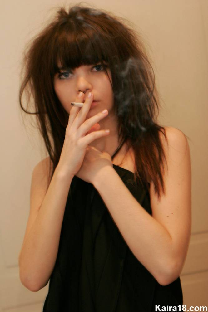Skinny teen Kaira 18 smoke while getting naked in a SFW manner - #14