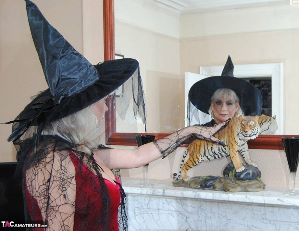 Middle-aged platinum blonde Dimonty models lingerie and a witch's hat - #12