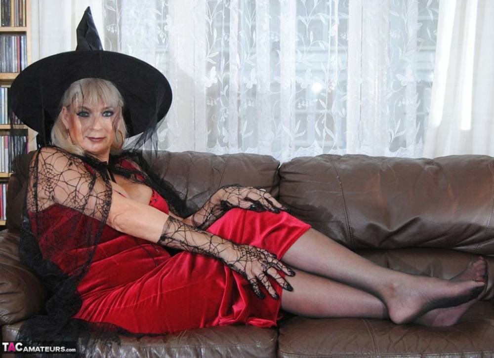 Middle-aged platinum blonde Dimonty models lingerie and a witch's hat - #1