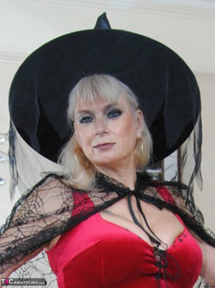 Middle-aged platinum blonde Dimonty models lingerie and a witch's hat - #6