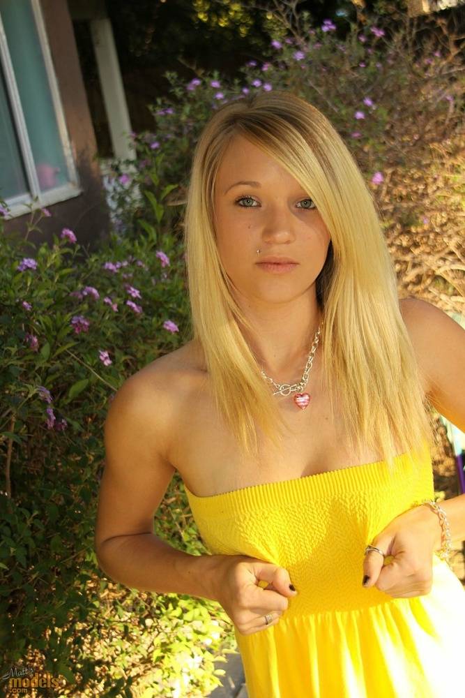 Blonde amateur Teagan bares her A-cup tits in a yard as she gets totally naked - #14