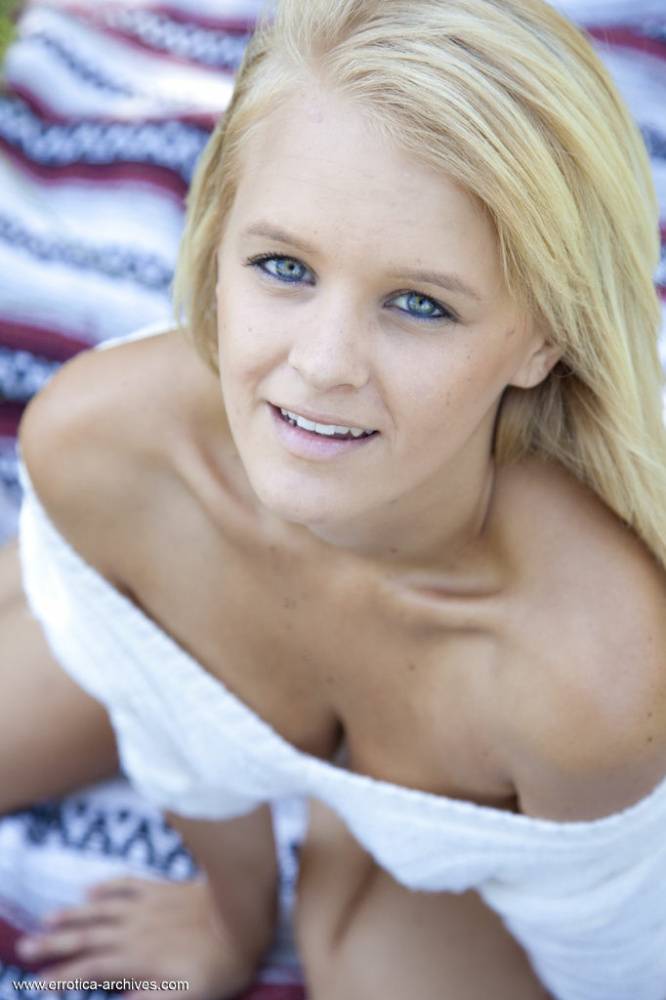 Blue eyed blonde teen Marie casts off her clothes to pose nude in a field - #16
