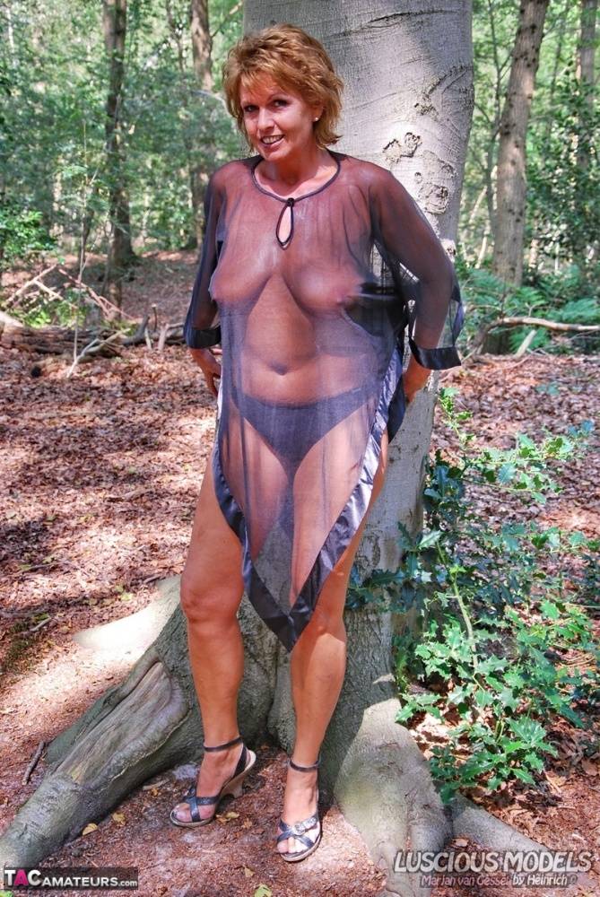 Hot older woman Luscious Models wears see thru attire while in the woods - #7