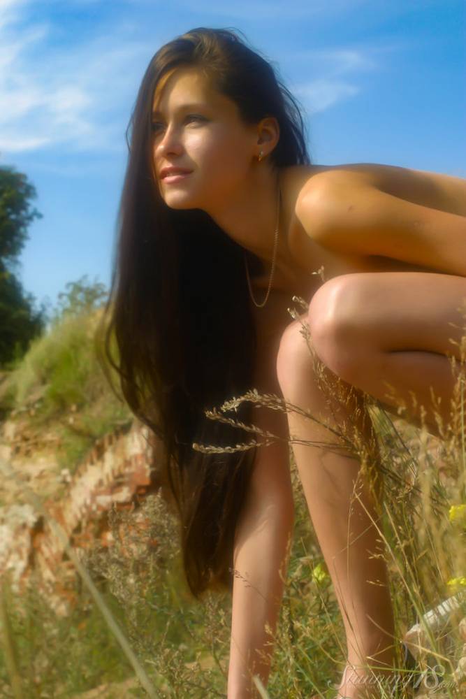 Young brunette Bellanca L displays her naked figure on a hill in heels - #3