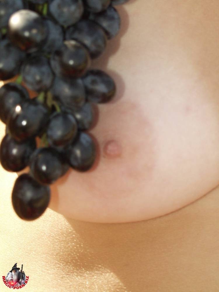 Teen amateur licks a bunch of grapes while bare naked on a hilly field - #9