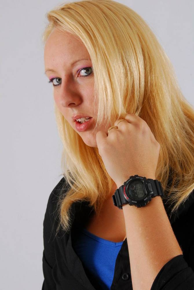 Blue-eyed blonde Britt displays her black G-Shock during non-nude action - #5