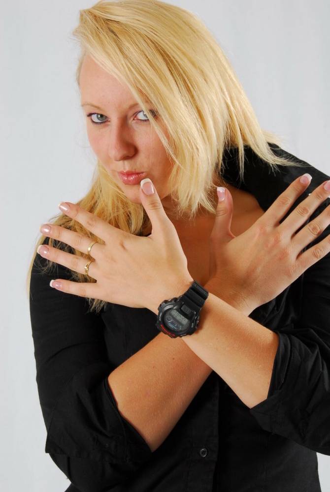 Blue-eyed blonde Britt displays her black G-Shock during non-nude action - #7
