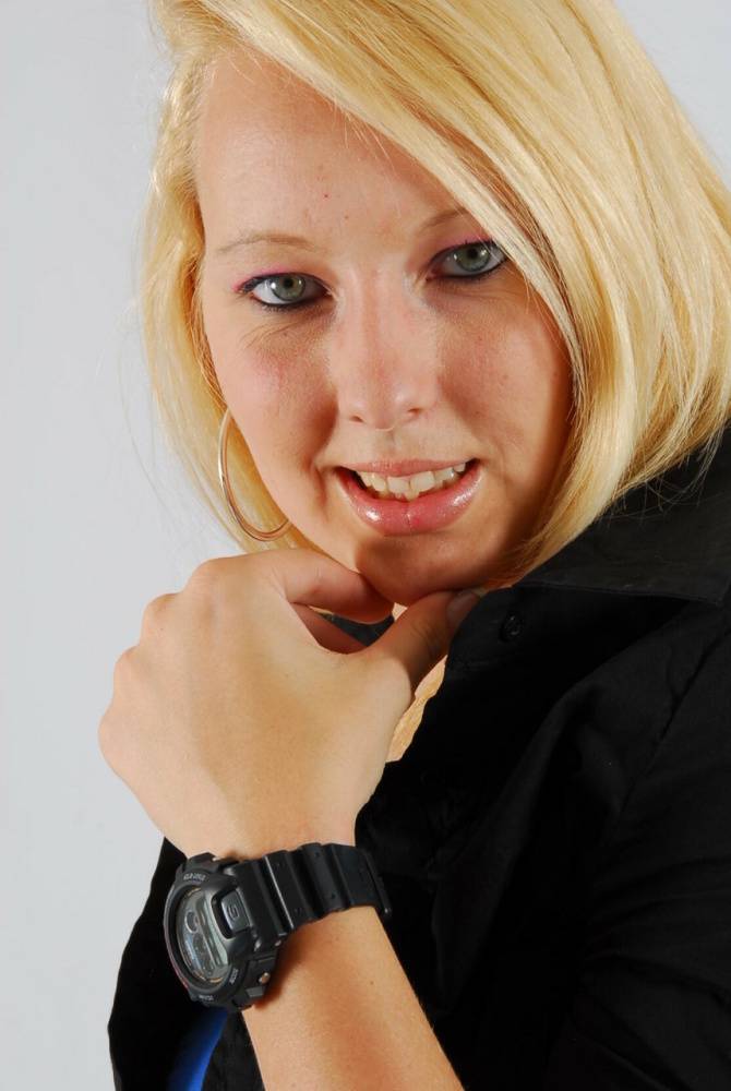Blue-eyed blonde Britt displays her black G-Shock during non-nude action - #11