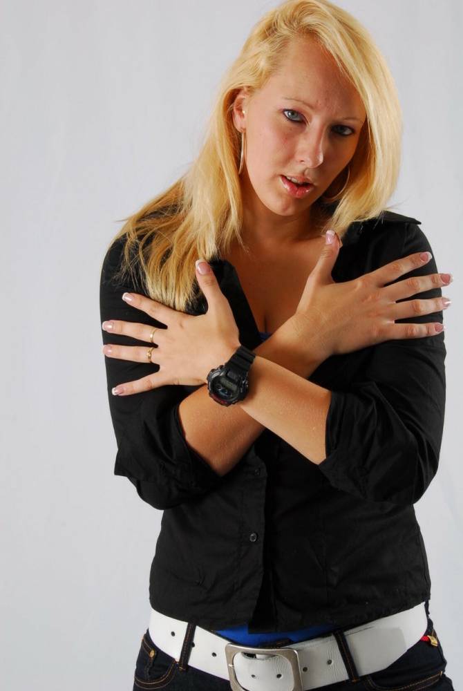Blue-eyed blonde Britt displays her black G-Shock during non-nude action - #6