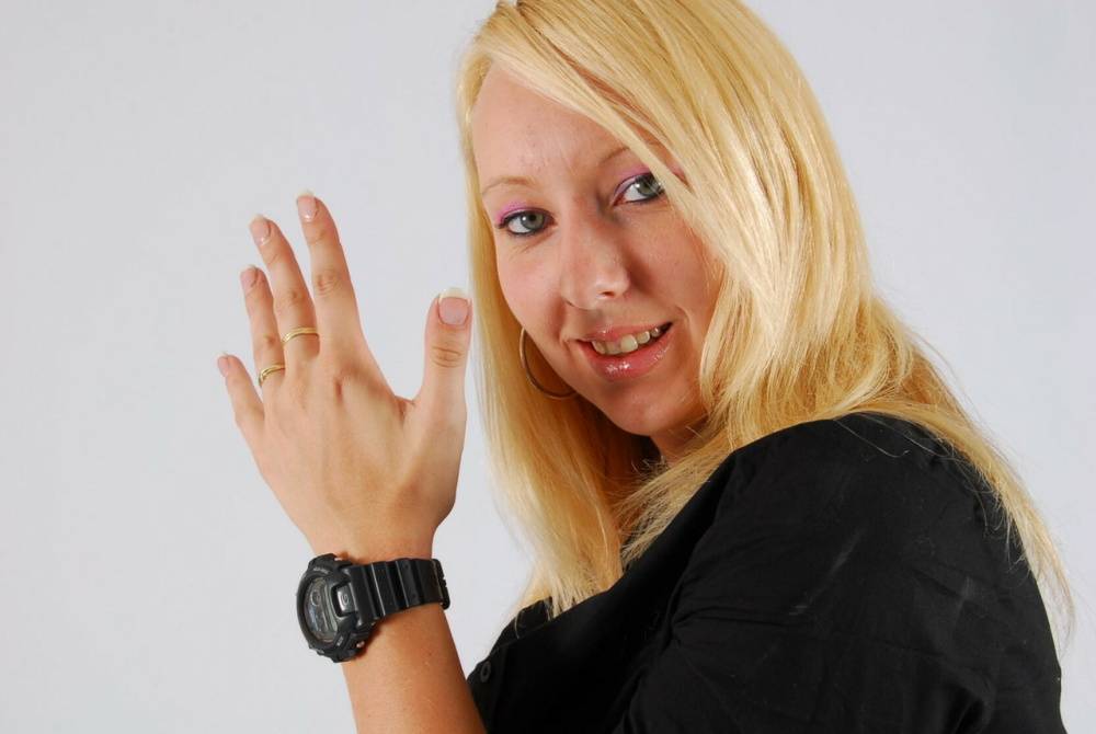 Blue-eyed blonde Britt displays her black G-Shock during non-nude action - #15