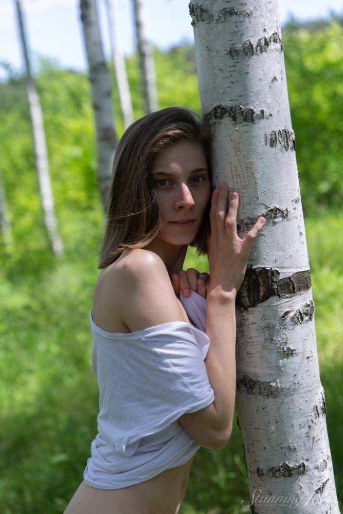 Skinny 18-year-old Anna R grabs her tight ass and snatch against a birch tree - #13