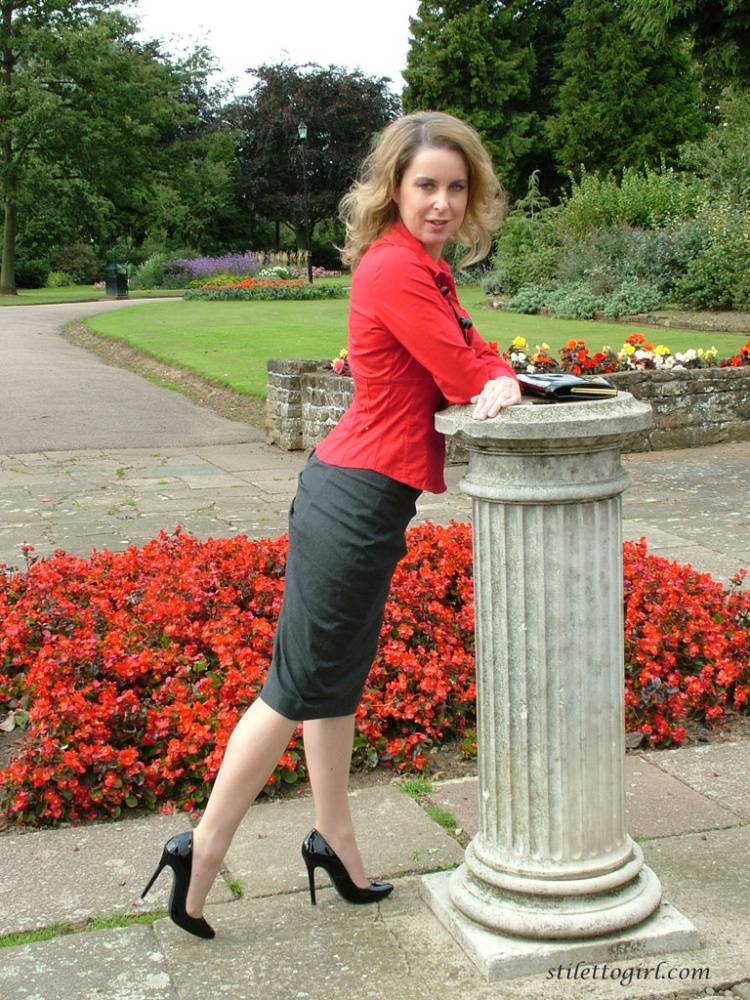 Fully clothed woman steps out of a stiletto heel while visiting a public park - #5