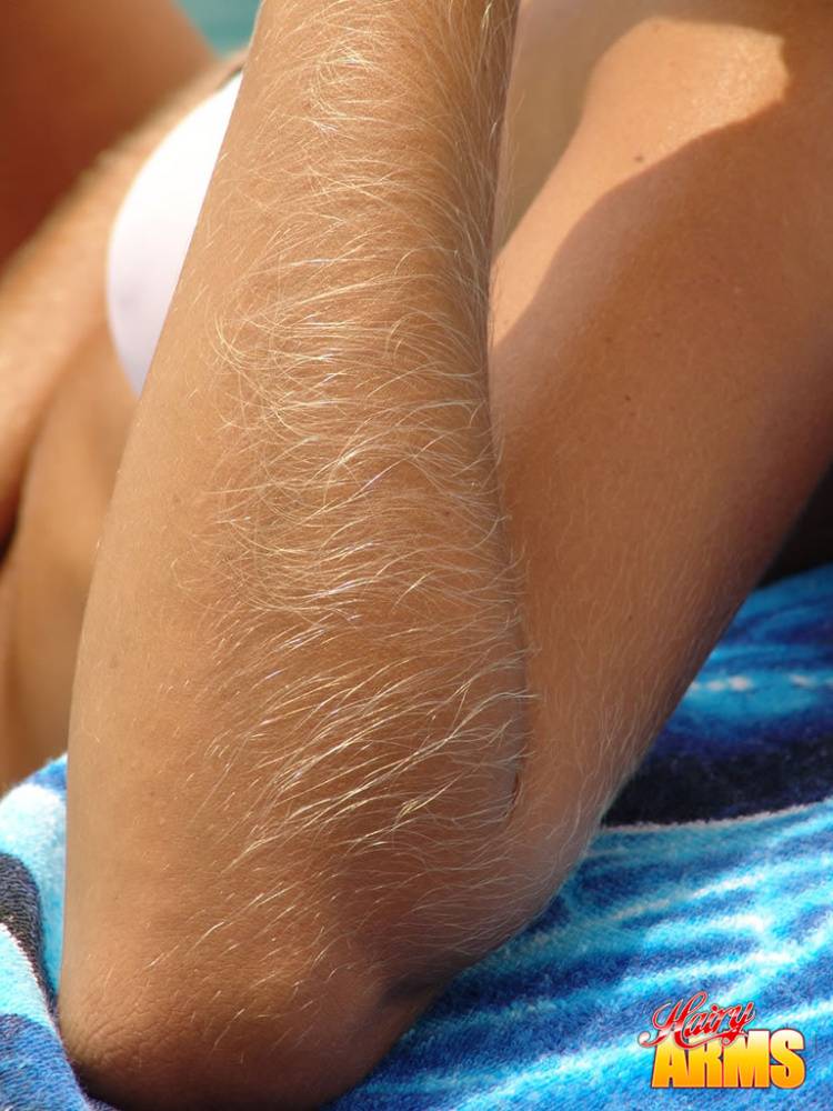 Middle-aged amateur with hairy arms models in a bikini next to the ocean - #10