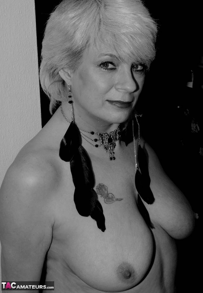 Older woman with natural breasts models naked in stockings - #8