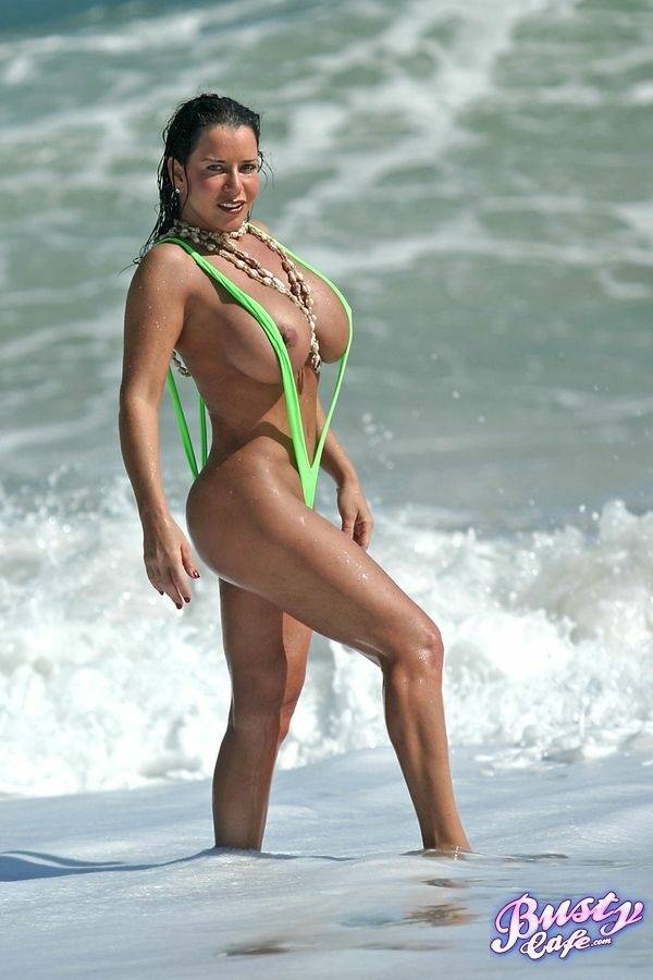 Amply endowed female Alicia Dimarco struts in a v-bikini amid foamy surf - #11