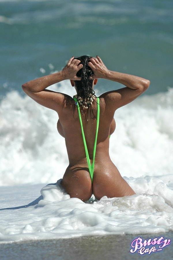Amply endowed female Alicia Dimarco struts in a v-bikini amid foamy surf - #6