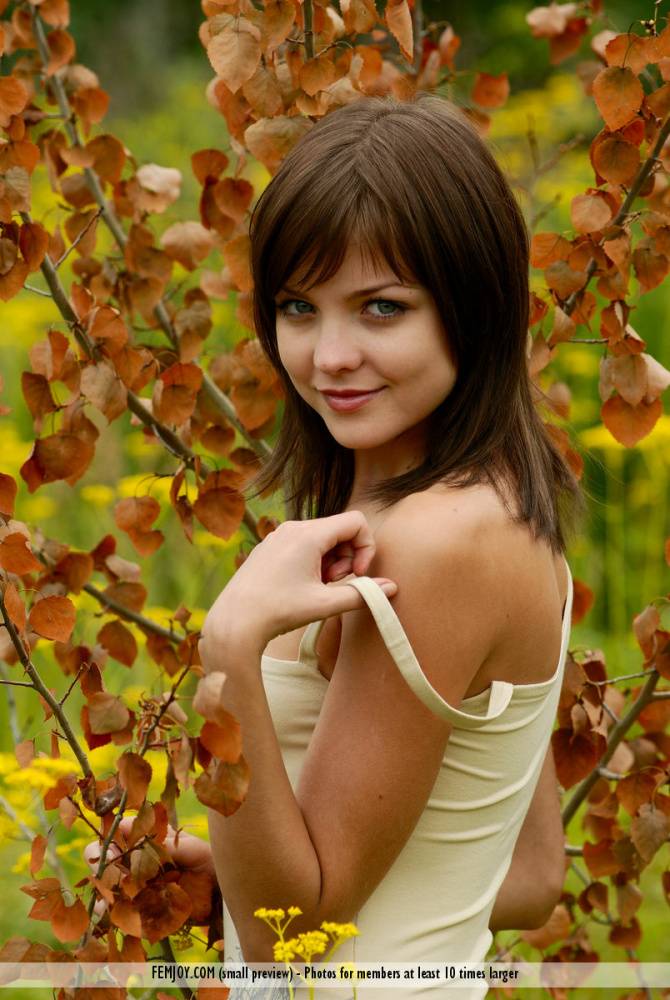 Adorable teen with perky tits and sexy butt models naked amid blooming weeds - #10
