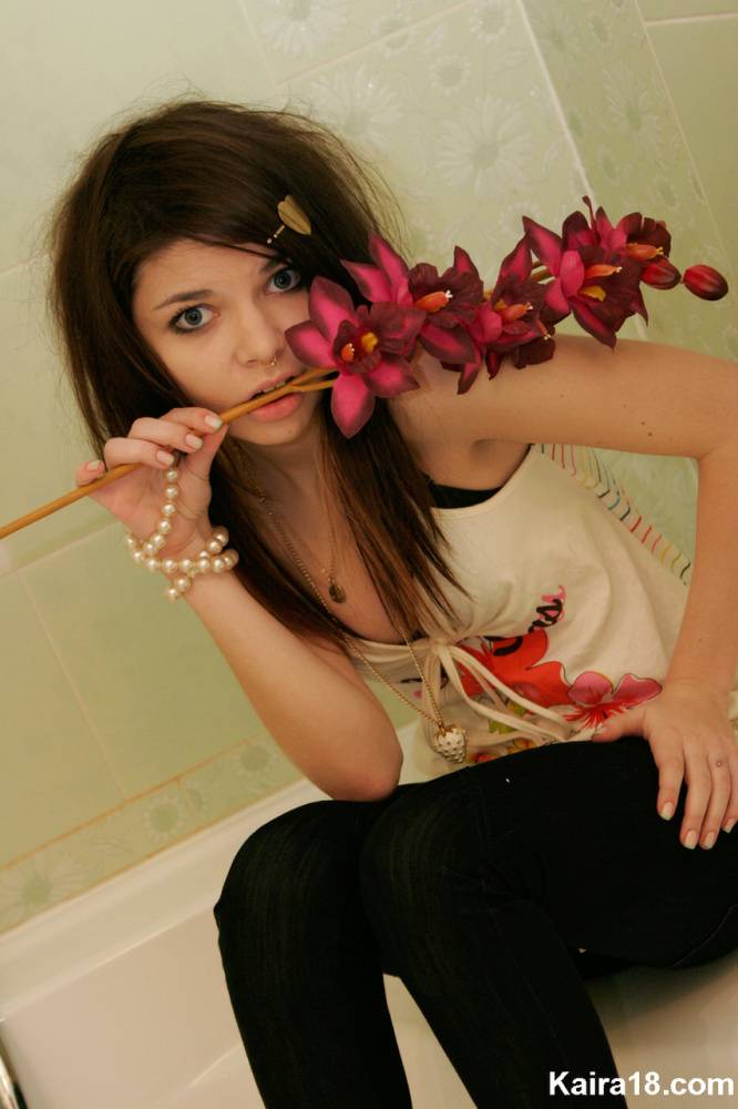 Tiny teen Kaira 18 scrunches up her face during a non nude shoot in a bathroom - #1