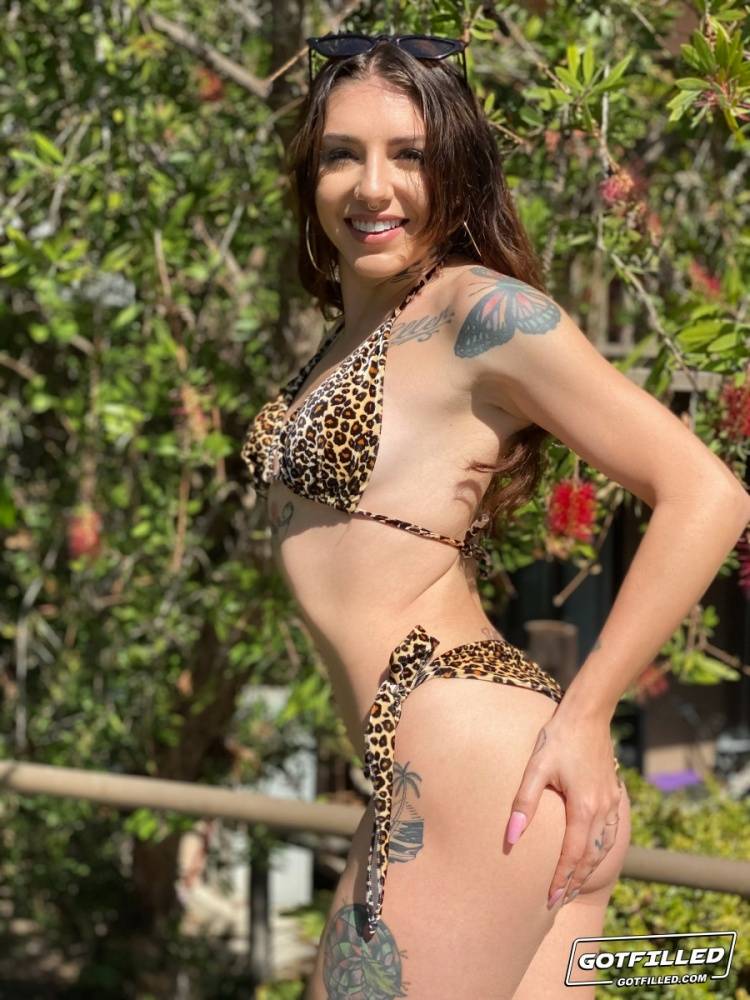 Tattooed brunette Brenna Mckenna models a bikini at a marina before having sex - #11