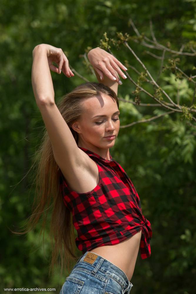 Slim teen Andrea Sixth strips to her footwear on a log in nature - #9