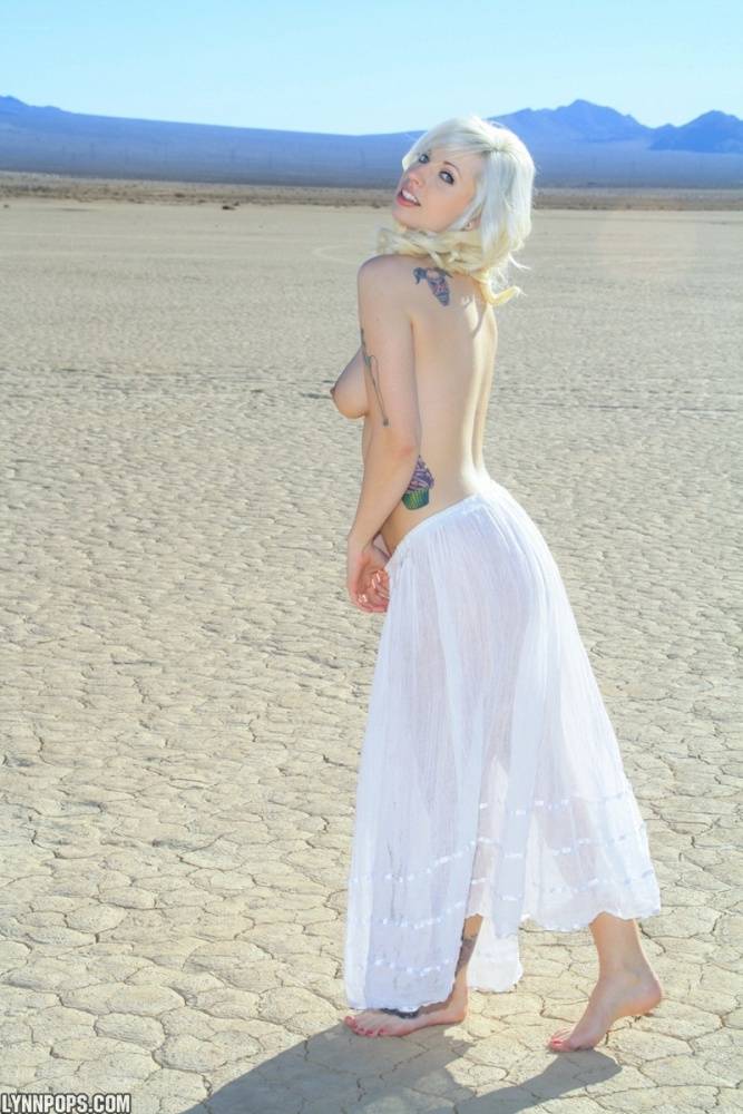 Sexy blonde Lynn Pops goes topless on a dry lake before exposing her vagina - #7