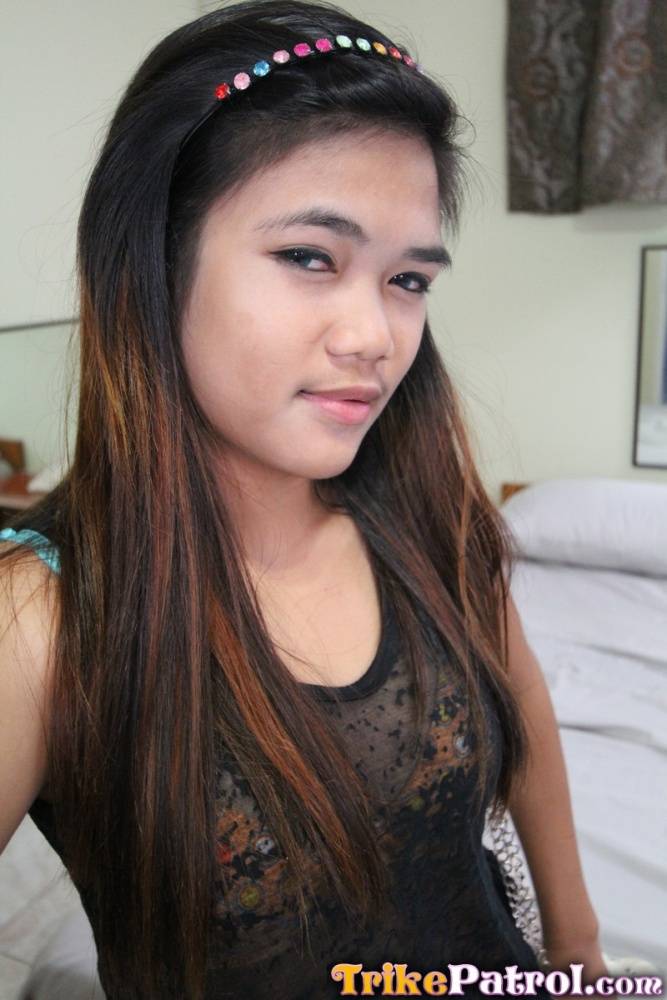 Young Filipina girl with a saucy look stands naked after undressing - #12