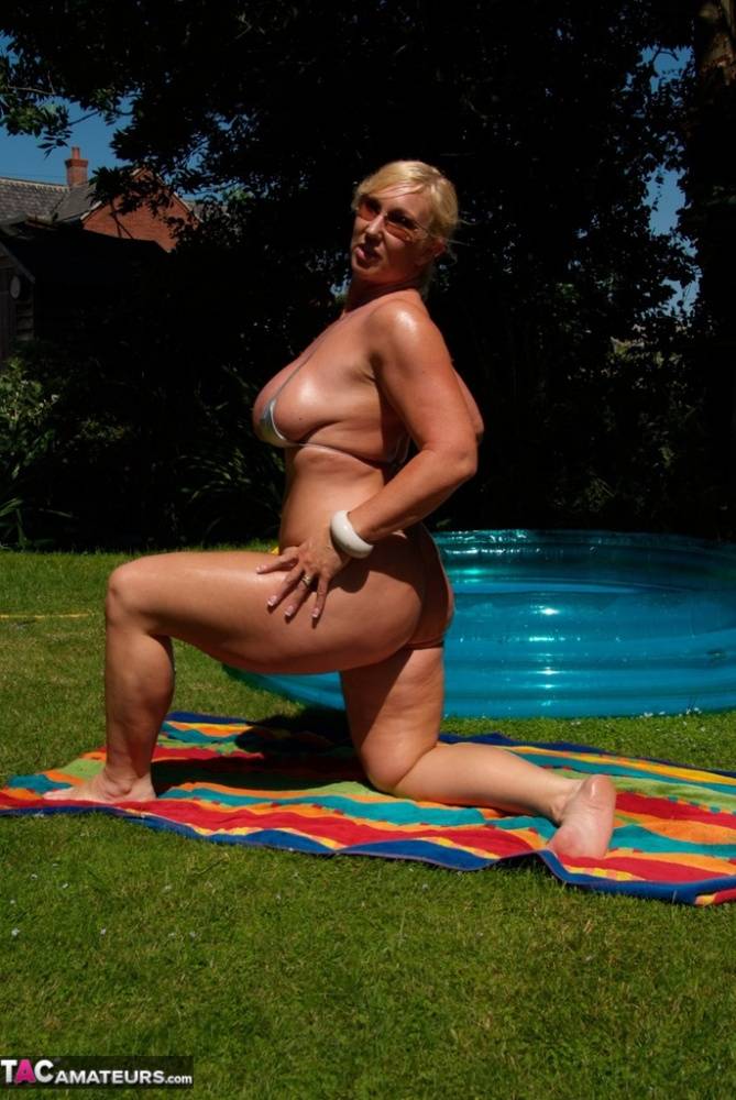 Fat blonde woman Melody uncups oil laden juggs from bikini in sunglasses - #3