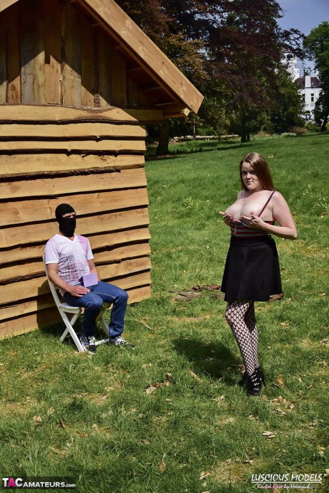 Natural redhead masturbates on a lawn before teasing a masked man - #7