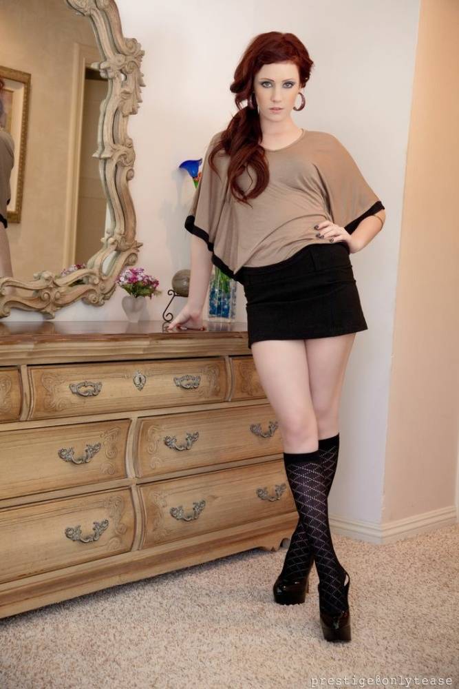 Pale redhead Elle Alexandra strips to knee sock and a thong afore a mirror - #6