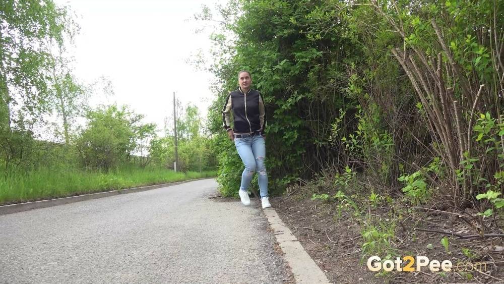 Clothed girl pulls down ripped jeans for a pee while bicyclists pass by her - #7