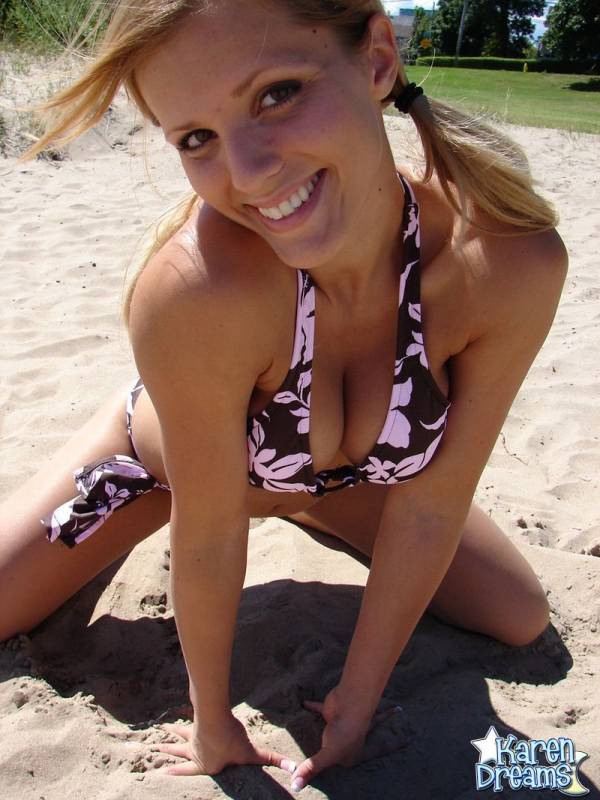 Blonde teen Karen models a bikini while on a patch of sand - #2