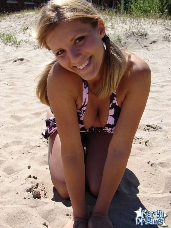 Blonde teen Karen models a bikini while on a patch of sand - #1