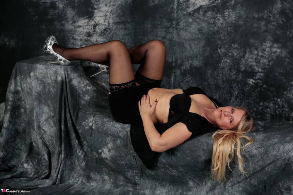 Aged blonde Sweet Susi looses her natural tits from a black dress in stockings - #16