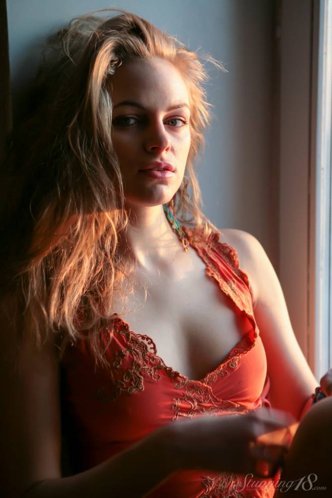 Young blonde Magdalone R strikes great semi nude poses in a windowsill - #16