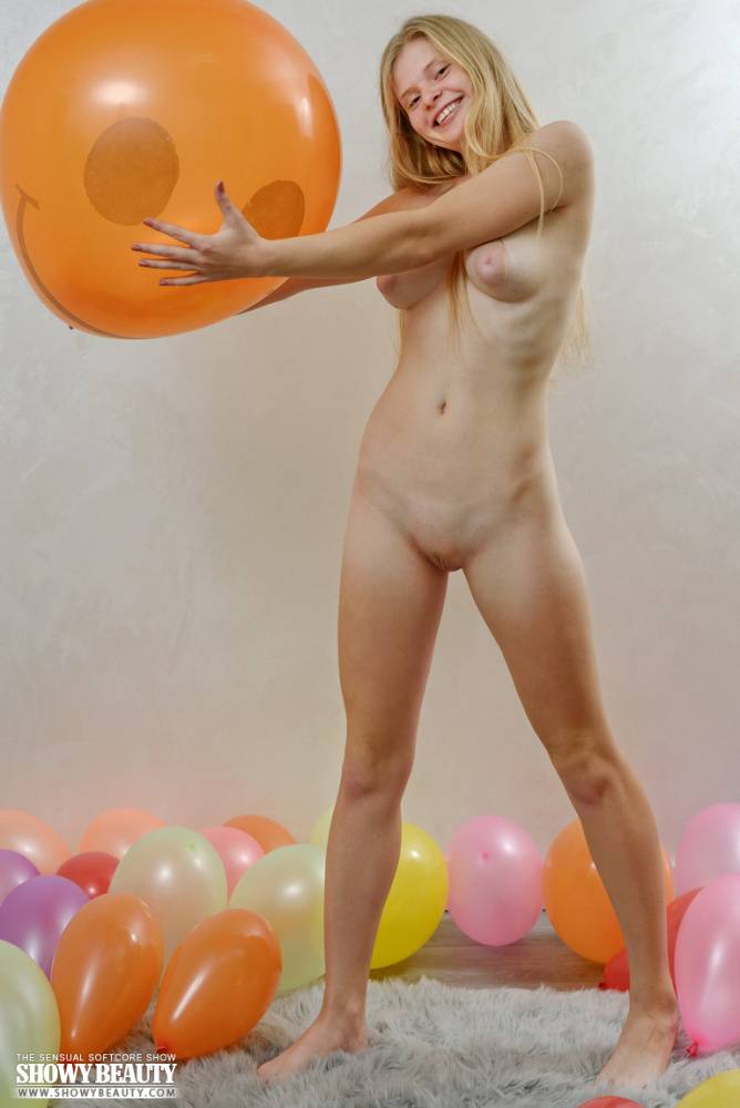 Young looking blonde Agust D holds a balloon during a totally nude session - #13