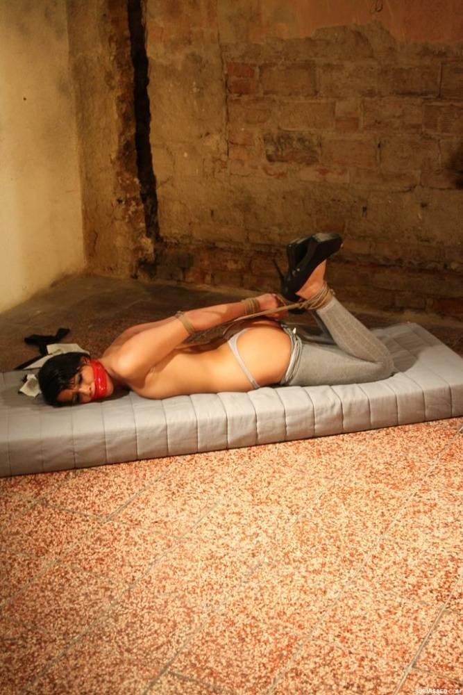 Brunette female Samantha Joons finds herself gagged and hogtied on a mattress - #8