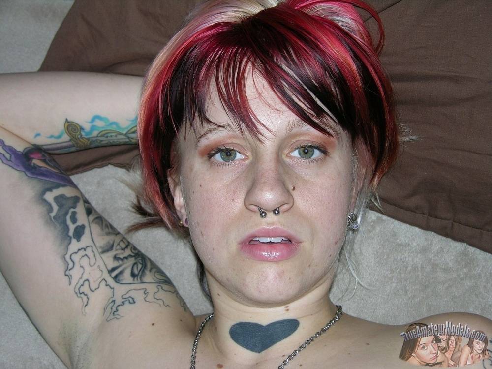 Amateur girl with piercings and dyed hair shows her natural pussy on love seat - #7