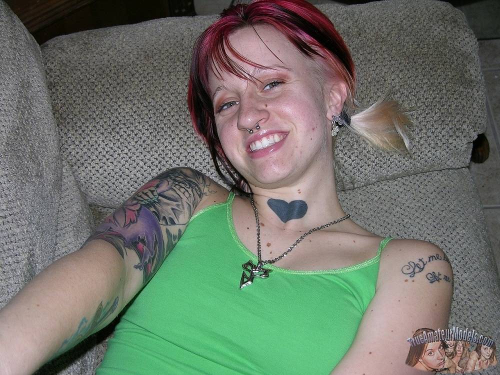 Amateur girl with piercings and dyed hair shows her natural pussy on love seat - #9