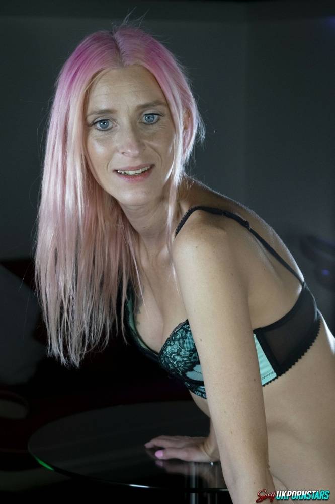Caucasian female Roxy Lace models a bra and thong set while sporting dyed hair - #14