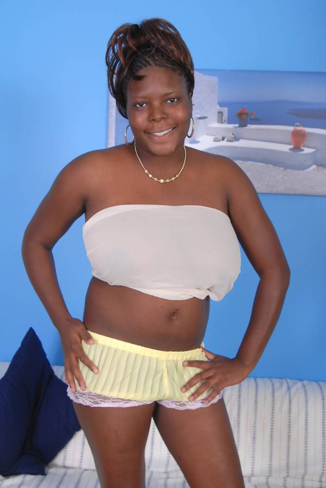 Older black woman Athena holds her large breasts while getting undressed - #7