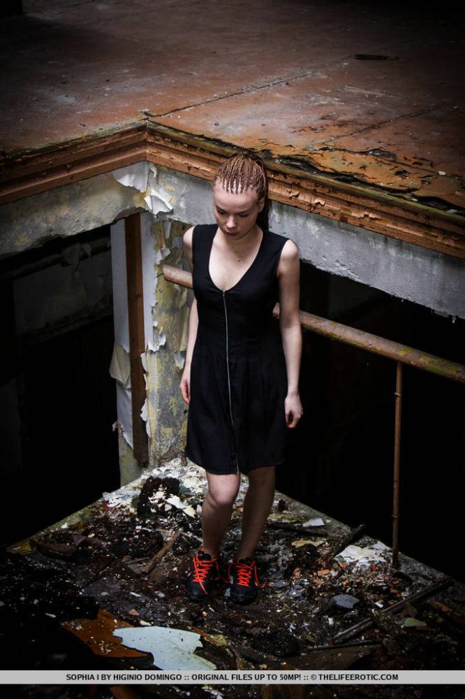 Slender teen Sophia I stands naked after disrobing in an abandoned building - #9