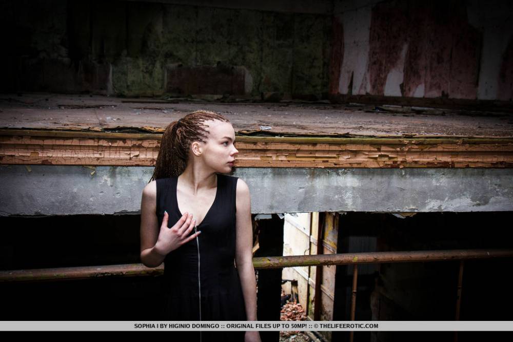 Slender teen Sophia I stands naked after disrobing in an abandoned building - #8