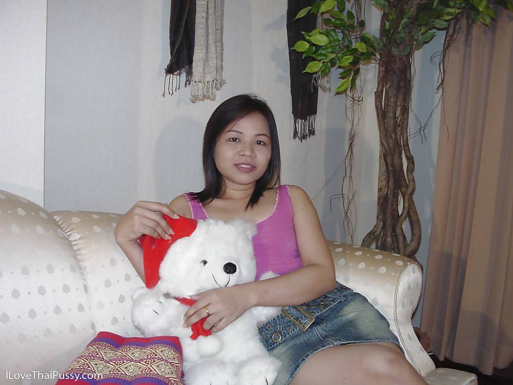 Chubby asian cutie taking off her clothes and posing naked on the sofa - #1